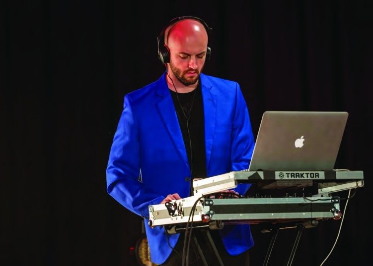 KEDA DJ mixing during the party set